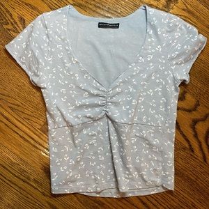 Brandy Melville light blue v-neck tee with white floral pattern